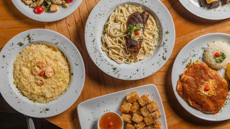 A top view of various gourmet dishes beautifully plated, showcasing Brazilian cuisine.